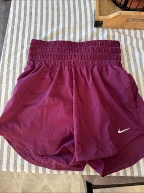 Nike Women's Burgundy Athletic Shorts with White Swoosh